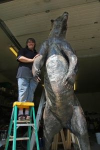 April Moore poses with the so far unnamed "new" bear