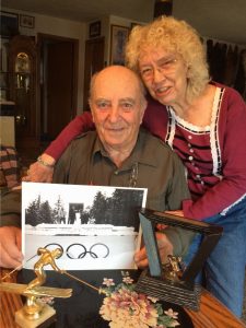 Carl and Brenda Thomas with a picture of Carl at the 1964 Winter Olympics.