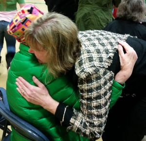 Talkeetna Elementary Principal Lisa Shelby embraces Elinore Ebling, wife of the late Myron F. "Ace" Ebling, for whom VFW Post 3836 is named.  Photo: AJ Sullivan