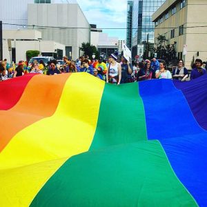 A large Pride flag at Pride Fest in Anchorage.  Photo courtesy of Lillian Rust