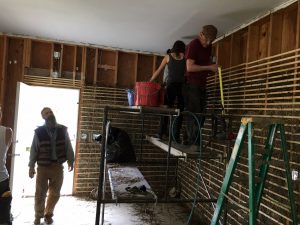 Lasse Holmes (L) looks on as workshop participants apply the methods he is teaching. Photo: Katie Writer - KTNA