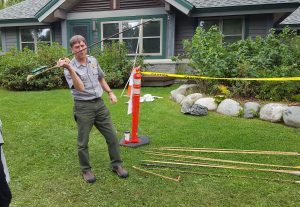 Denali National Park Ranger Roger Robinson tries his hand at the atlatl demonstration. Photo: Phillip Manning - KTNA