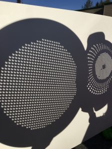 Monday's eclipse viewed through colanders. Note the partially obscured disk of the sun. Photo: Katie Writer - KTNA