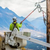 A lineman services electric lines for Matanuska Electric Association