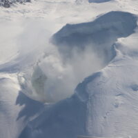 Gas emissions from the summit of Mount Spurr during the 03/11/2025 overflight. The lake is partially visible on the left side of the image and otherwise obscured by the plume.