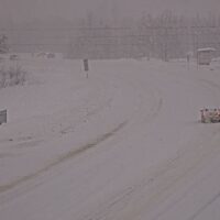Alaska DOT camera footage showing the junction of Parks Highway with the Talkeetna Spur Road, with snowy and icy conditions. January 27, 2026